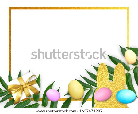 Mock up holiday composition with Easter colorful eggs,  golden bunny cutout, green leaves on white background. Happy Easter greeting card with golden frame.


