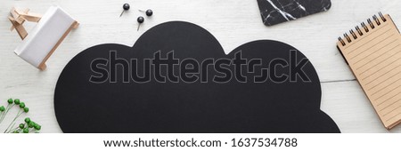 Wooden white desk with black speech bubble for text. Mockup. Copy space. Office accessories. Panoramic photo. Panorama