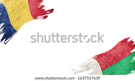 Flags of Romania and Madagascar on white background
