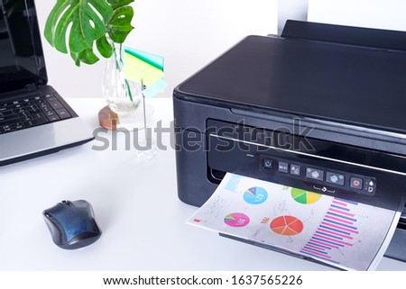 Printer and paper isolated on a white home table