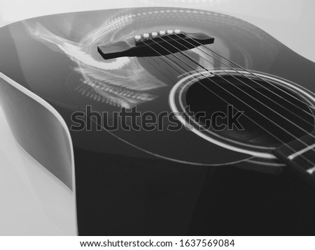 electric guitar  closeup in the stage light . Black and white                             