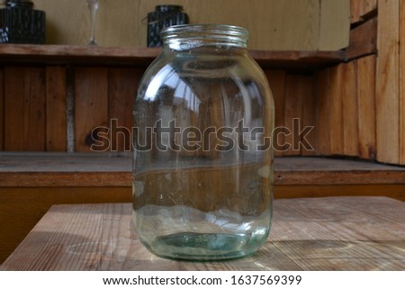 glass empty glass jar on wooden background