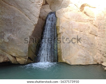 Picture of small fresh oasis in sahara, hard to see this amount of water in the hot dessert, Tunisia