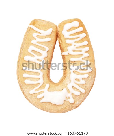 Light Christmas gingerbread in the form of the horseshoe  with glaze on the white
