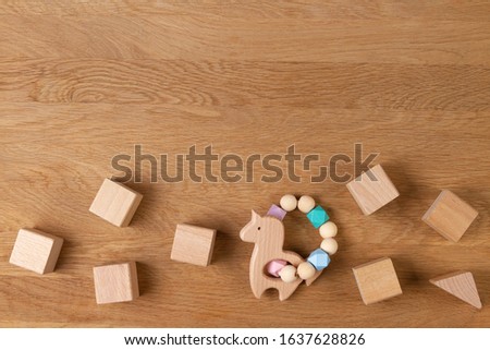 Baby kid educational natural eco zero waste wooden toys on wood background