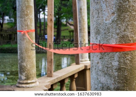 Red tape roping off a gazebo structure