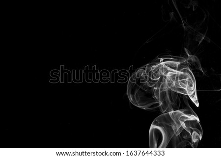 Picture of white cigar smoke in black view