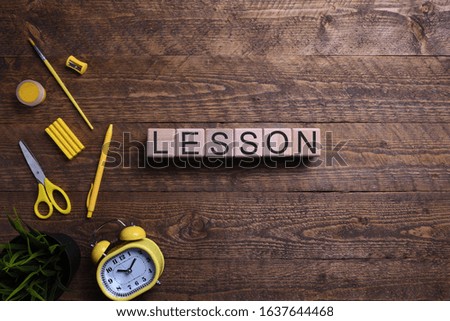 Word pass in wooden cubes, blocks on the subject of education, development and training on a wooden background. Top view. Place for text