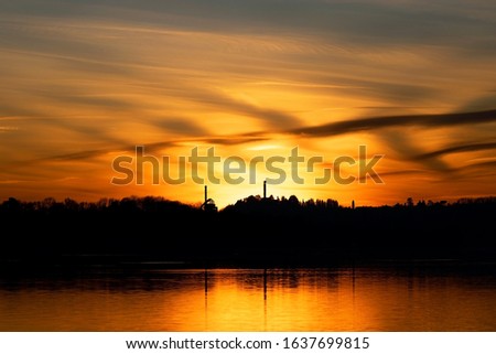An incredible fiery sunset on italian lake. Pusiano lake - Italy