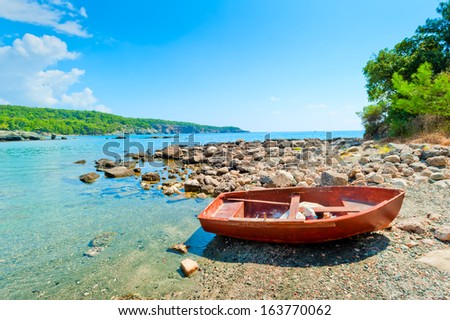 old boat on a rocky seashore