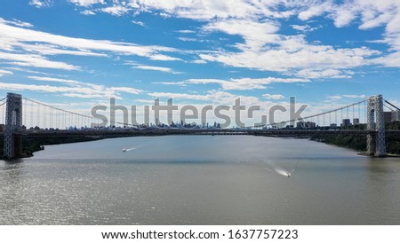Aerial Cityscape- George Washington Bridge- Hudson River, New York City View - Blue Sky with Clouds with Boat