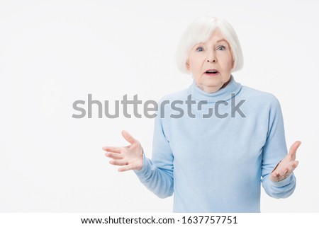 Caucasian senior woman feeling shock isolated on white studio background