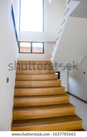 Minimalistic stairs in modern interior,Wooden stairs at modern ,white wall