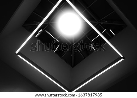Black and white framework with glowing lamp background