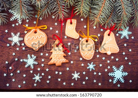 Gingerbread cookies on wooden background. Christmas card. Free space for your text