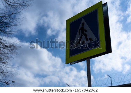 Yellow pedestrian crossing road sign