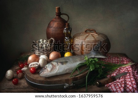 Still life with fish and vegetables on a kitchen table