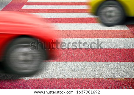 Red and white pedestrian crossing.
Notes for the Ispector: the silhouette of the car has been modified and is not recognizable
