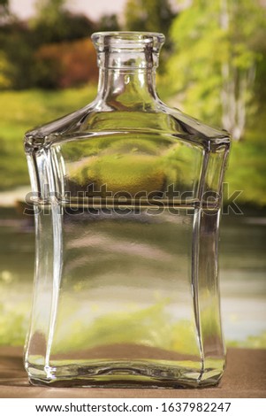 Wedding decoration of two bottle with hearth and love sign on a window.