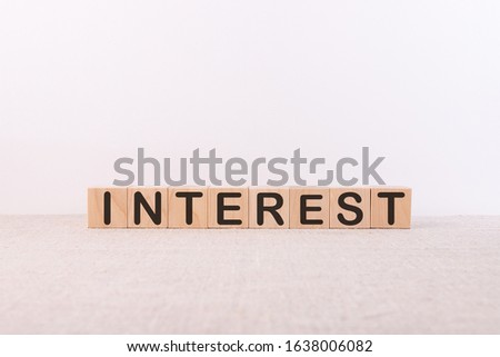 Interest rate financial and mortgage rates concept concept word written on wooden cubes on a light table and light background