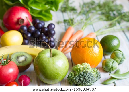 Composition still life fresh fruits and vegetables on wooden board healthy diet lifestyle concept