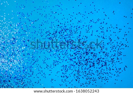 festive abstract blue background with blue glitters