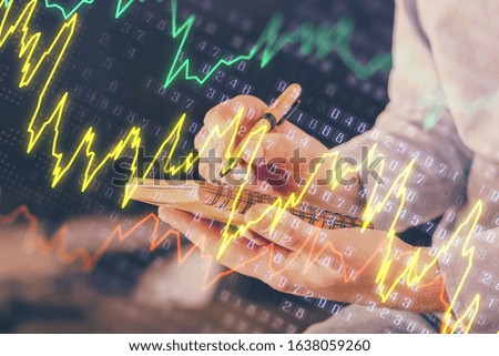 Double exposure hands with stock market chart.