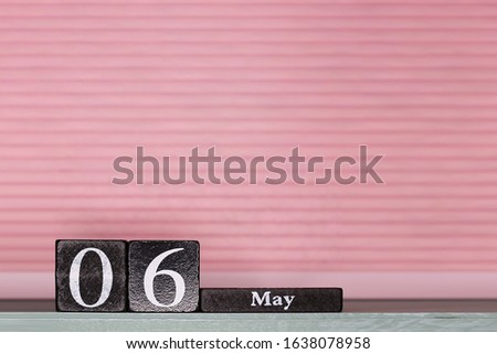 May 6, day 6 of month, calendar on a wooden cubes