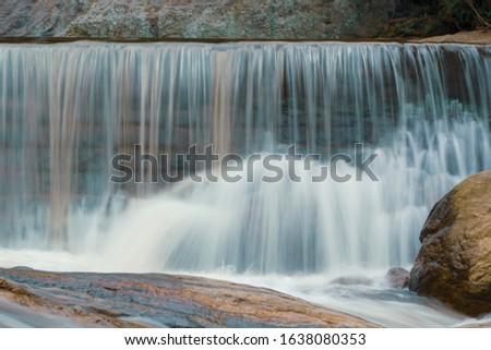 kurangini Madurai Tamilnadu India motion blur waterfalls beautiful sunny day bright forest meadows rocks 