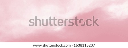 Pink sky with white cloud. The sky before a large storm. Pink background.