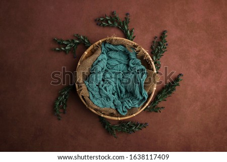 Newborn photography digital background prop. wicker basket on a painted canvas. Royalty-Free Stock Photo #1638117409