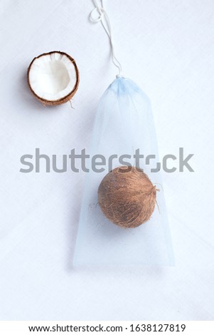 grocery eco bag with fresh coconut. white background. zero waste concept