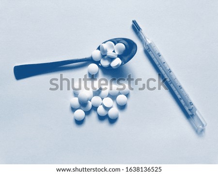 Medical pill tablet isolated on white, clipping path included. PANTONE Blue