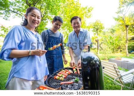 Happy elderly asian friend with barbecue grilled food party in park, Senior meeting