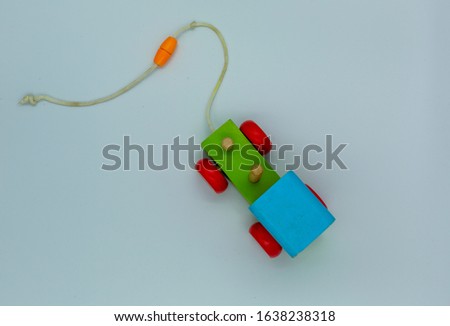 colorful wooden toy train on a white background, baby toy