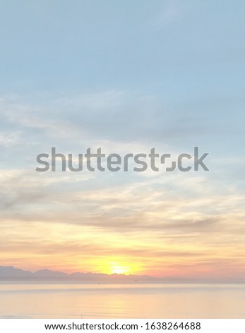 Faded sunset with beautiful clouds and ocean