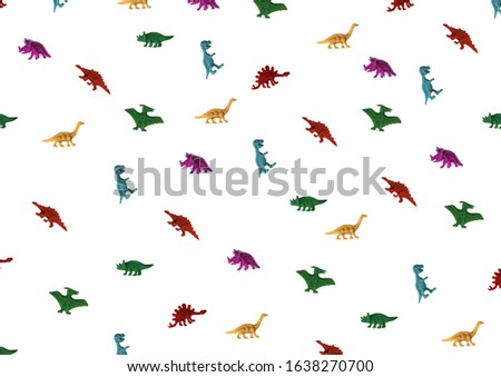 FLAT LAY OF COLORFUL PLASTIC DINOSAURS PATTERN ON WHITE BACKGROUND.