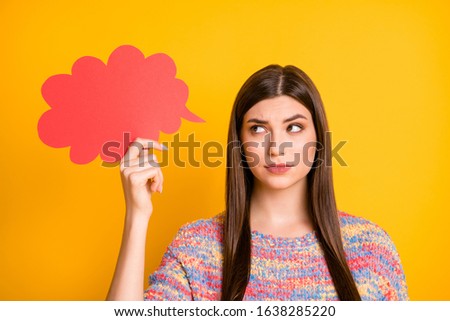 Close up photo of minded pensive girl hold red paper card think thoughts decide decisions choose choice try find solutions look feel nervous wear pullover isolated bright color background