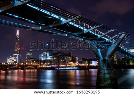 London at night with urban architectures, Tower bridge by the river Thames and Millennium bridge.