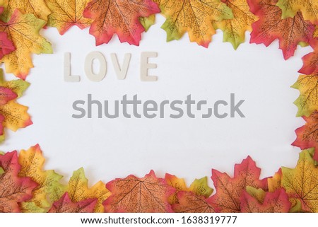 Love day concept. The wooden text remain to valentine's day with maple leaf and white background.valentine day, february14