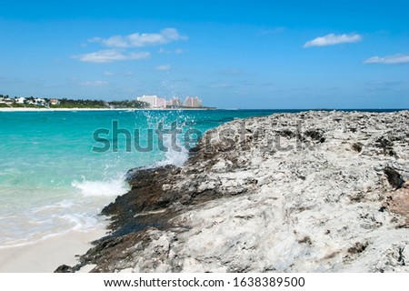 The coastline view and the wave splash on Paradise Island beach (Bahamas). 