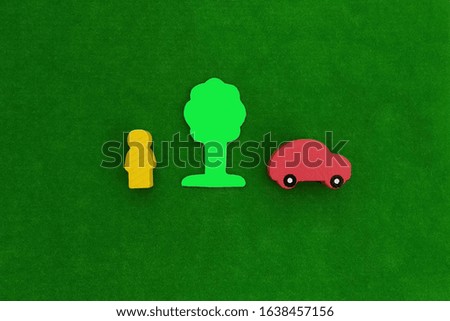 Person. tree, car on a green background . Ecology, transport, lifestyle.