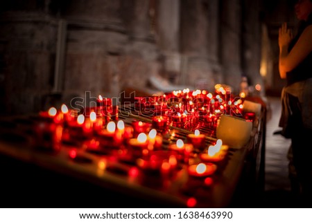 Candles in church picture with candles and prayer in temple fire as a symbol of purification through candle burning prayer for health in church Christianity
