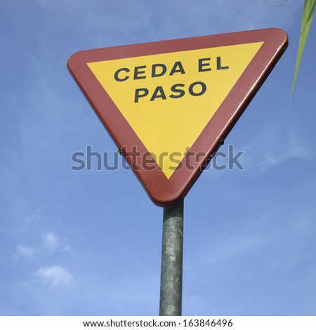Spanish yield sign and blue sky