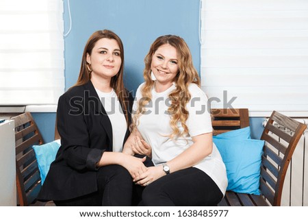 Two Young Women Models Plus Size. Close-up Portrait. Friendship