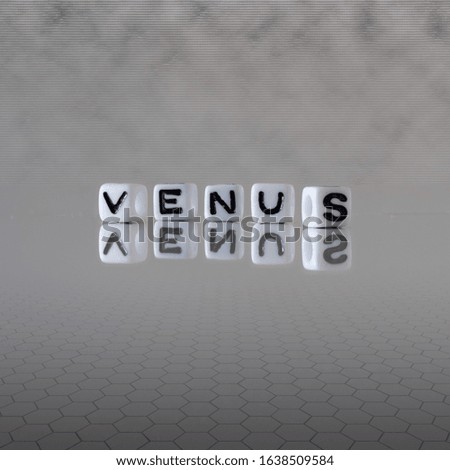 venus concept represented by wooden letter tiles