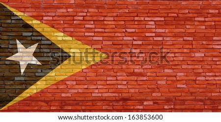 East Timo flag on texture brick wall. 