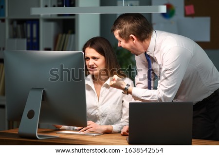 Man in the office is angry and shouts at the woman. Interaction with other departments in solving complex issues. Woman is not happy with management bad report. Motivation and professional development Royalty-Free Stock Photo #1638542554