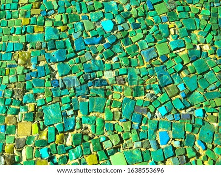Mosaic floor tiles green background with glasses texture
