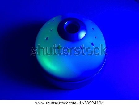 Glowing night lamp in different colors of RGB